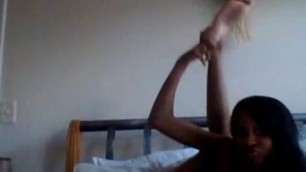 Sexy slim ebony chick plays with pussy